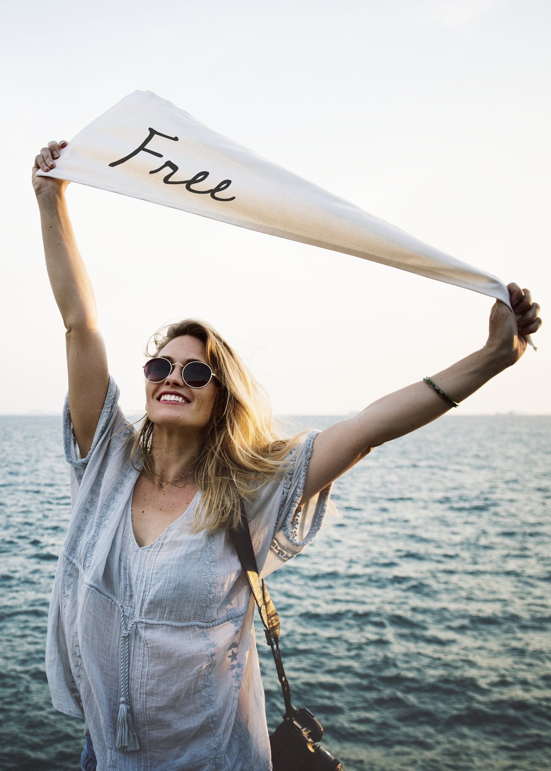 woman waving a banner over her head that reads