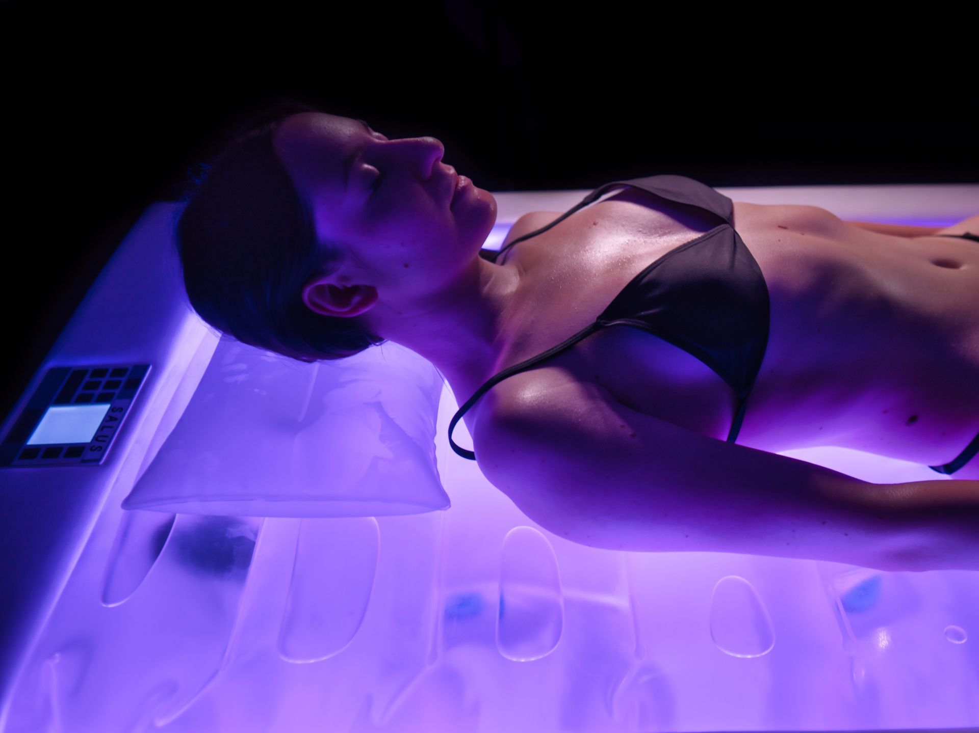 Person lying on an ISO Benessere professional massage table