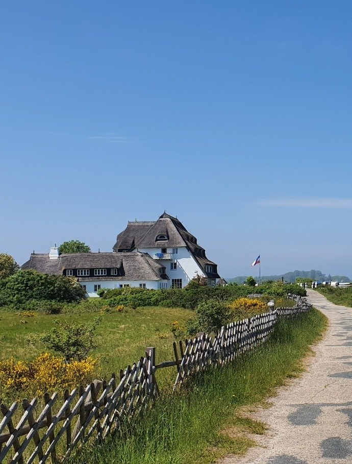© Tim Wegner Strandspaziergang Architektur Reetdach