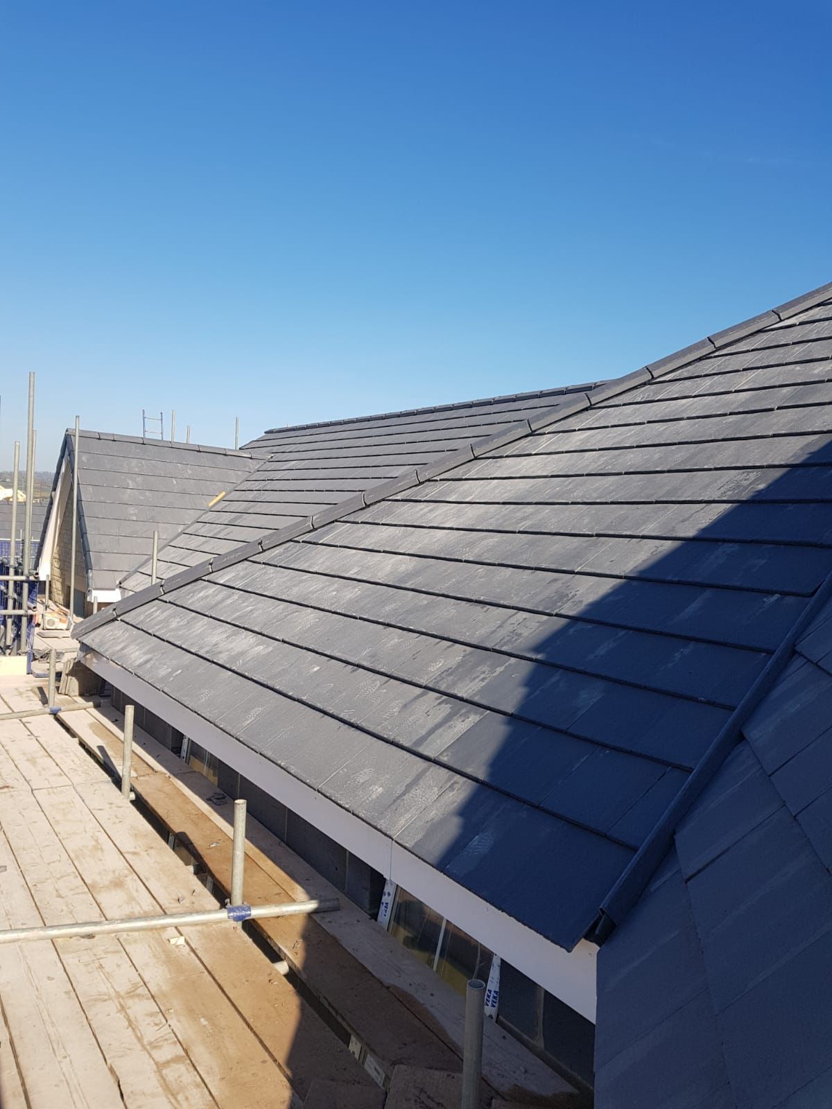 New concrete roof tile installation completed by tile roofers in Exeter