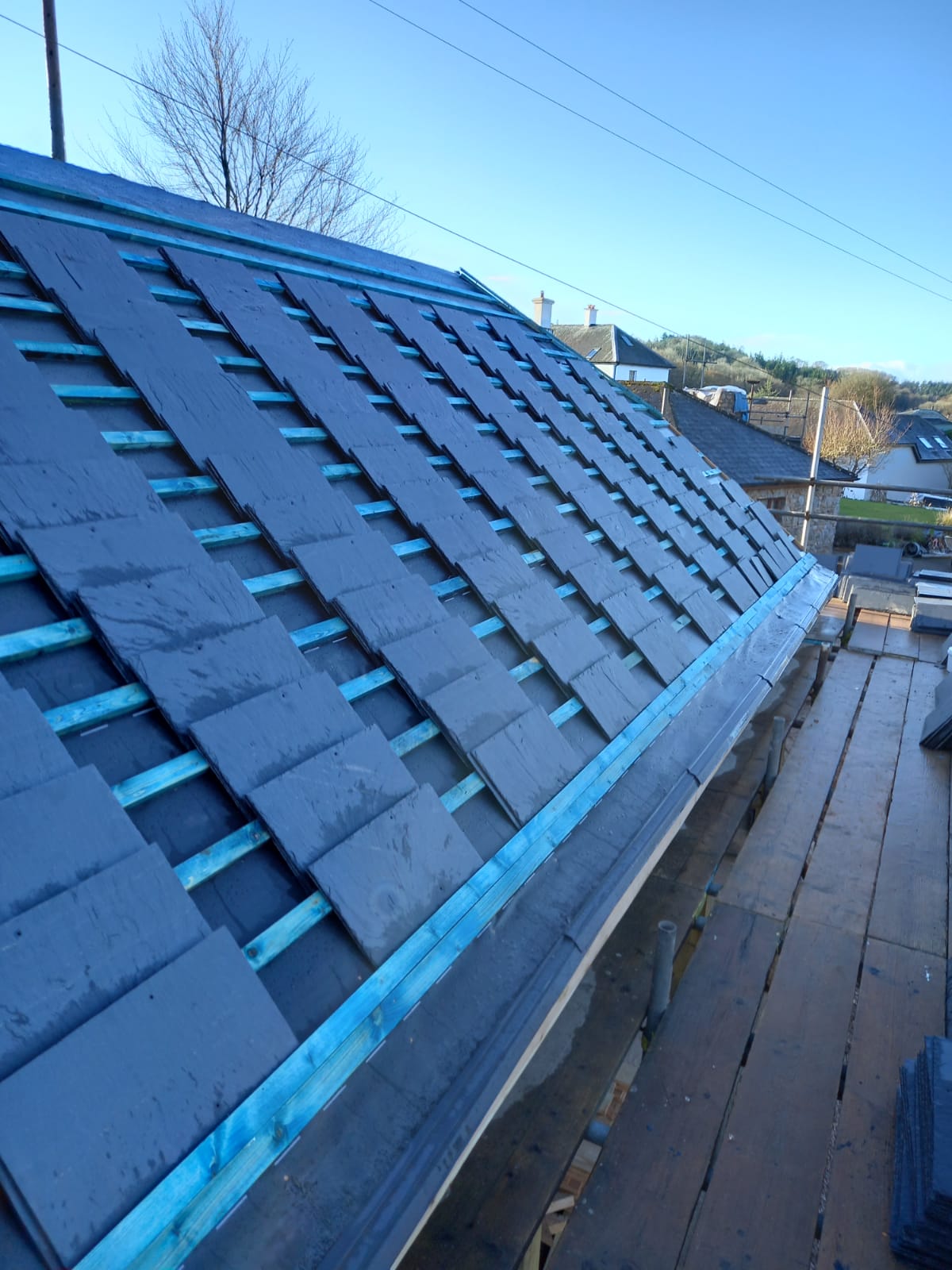 Completed slate roof replacement on detached property by roofers in Torquay