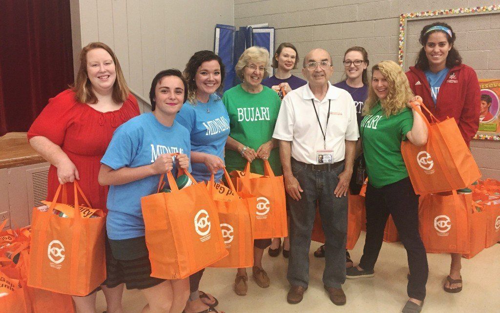 Chaplain John Unthank with students and supplies from Knoxville Dream Center