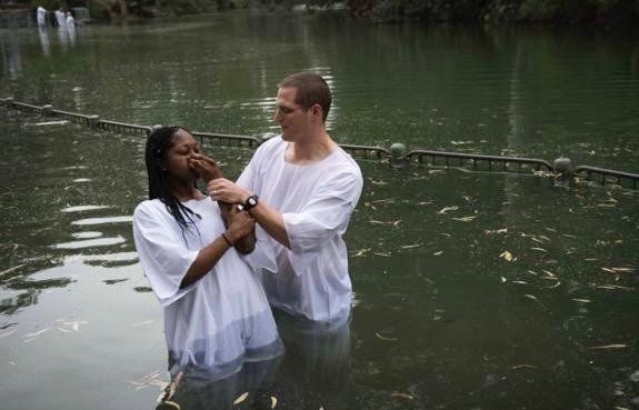 Chaplain Ethan Everts baptizes in the Jordan River