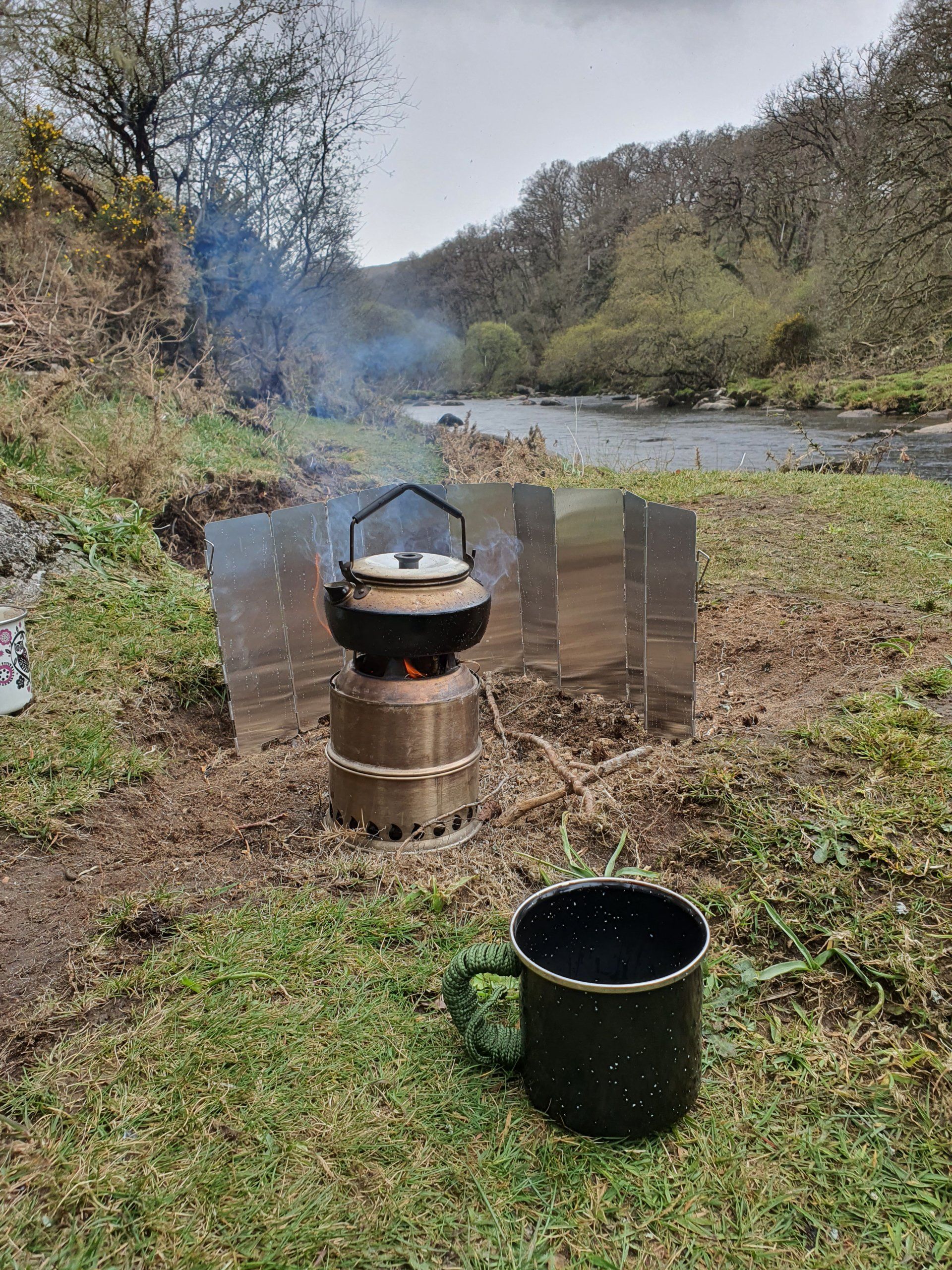 camp tea by river