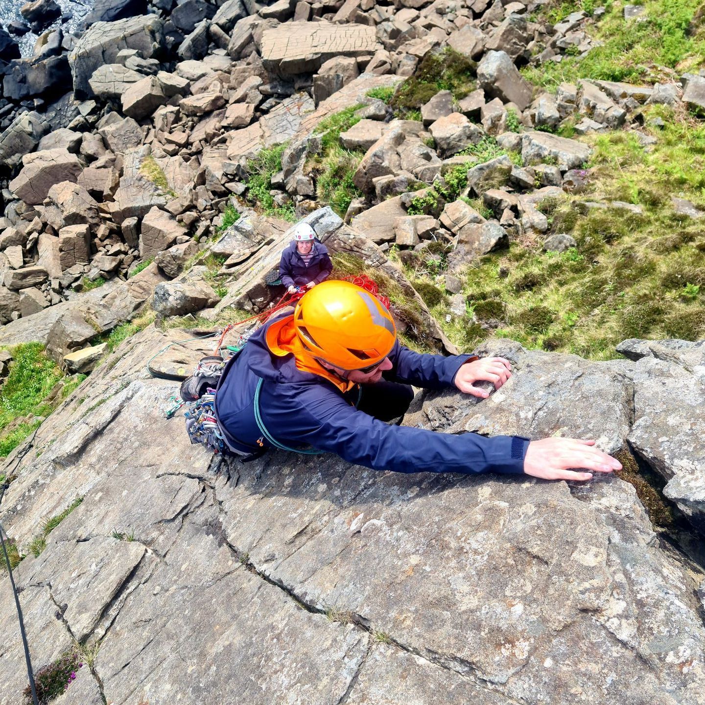 Learning to lead rock climb as part of a Rock Climbing Course and guiding rock climbing in Fort William, Scotland.