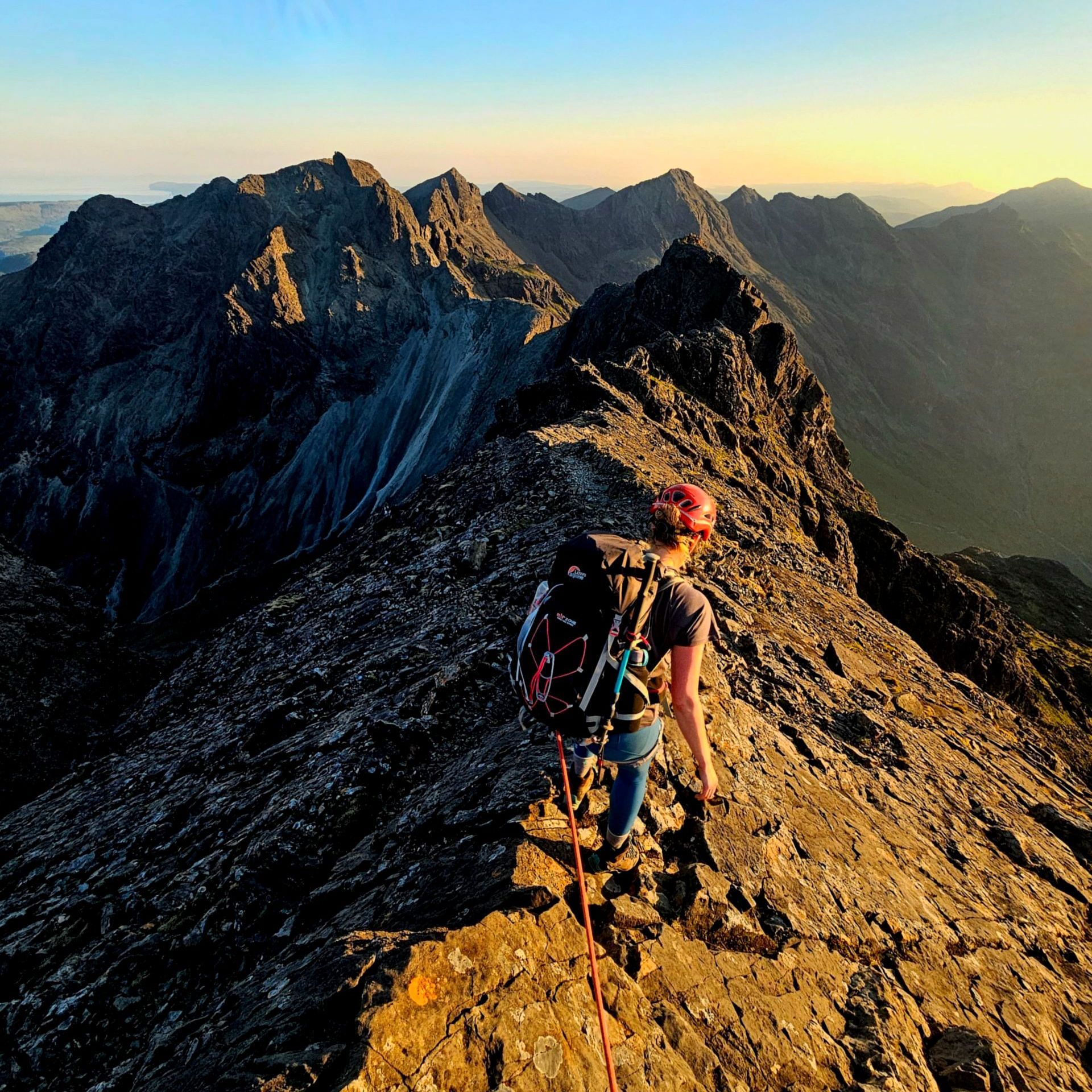 Descending Sgurr Thearlach at sunrise with a Skye Cuillin Ridge Traverse Guide from Elite Guides