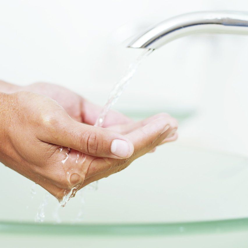 water ouring into hand