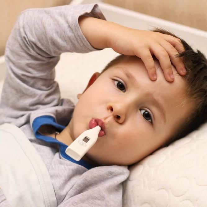 boy with thermometer in mouth