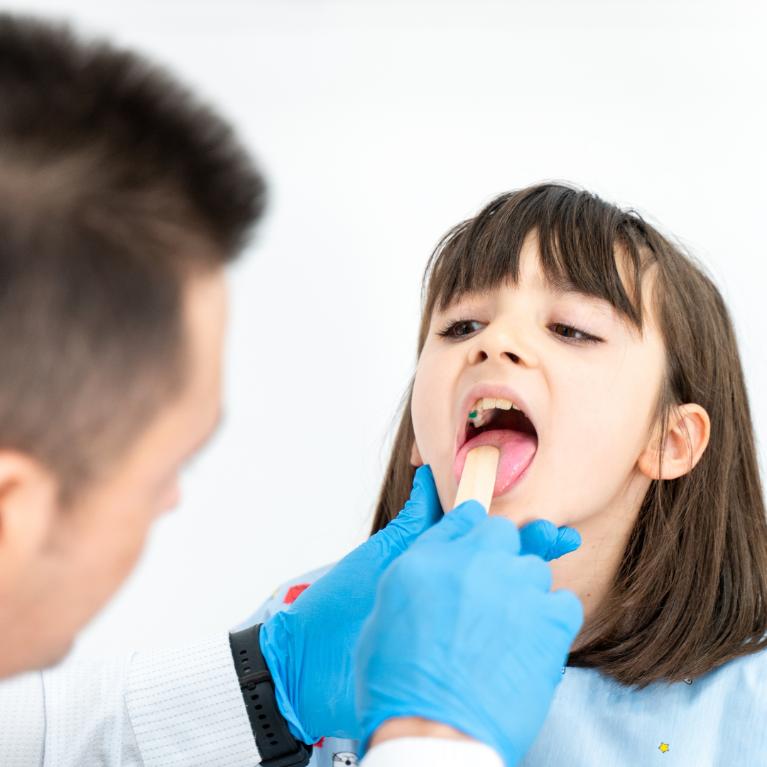 doctor looking in girls throat