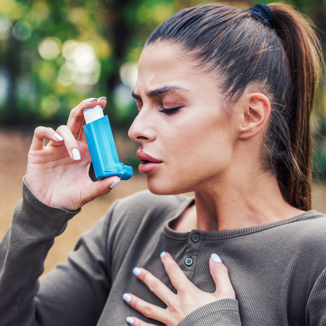 woman puffing inhaler