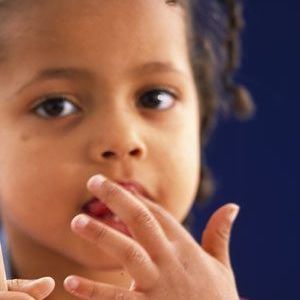child licking fingers