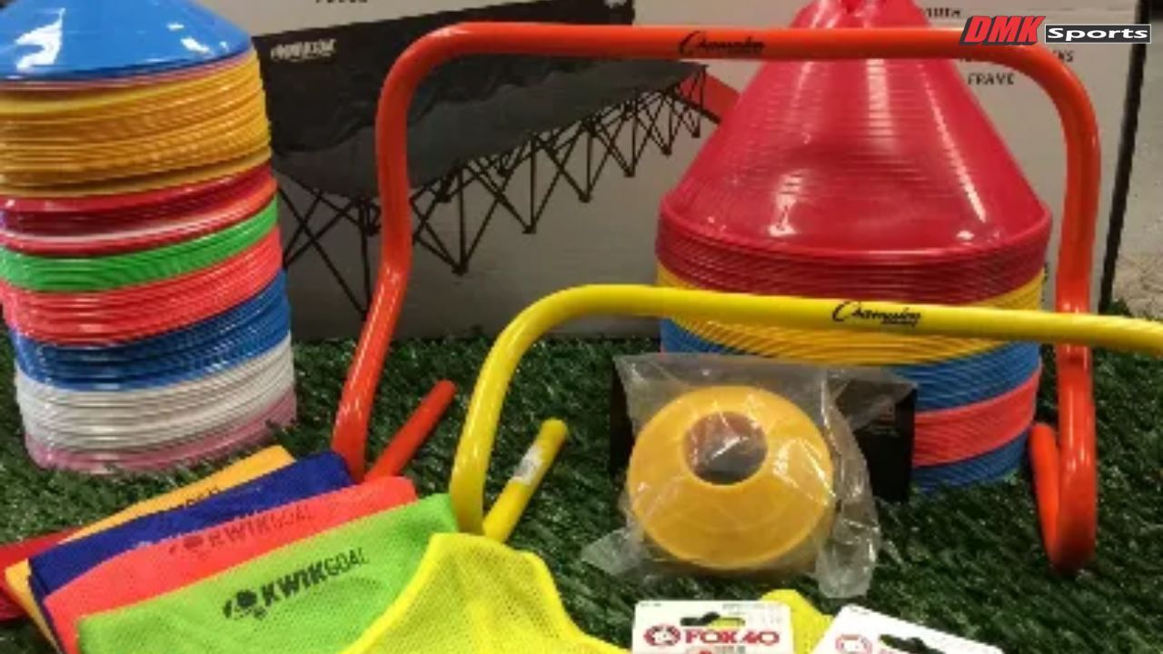 Stack of training cones with bibs, whistles, and markers for football practice