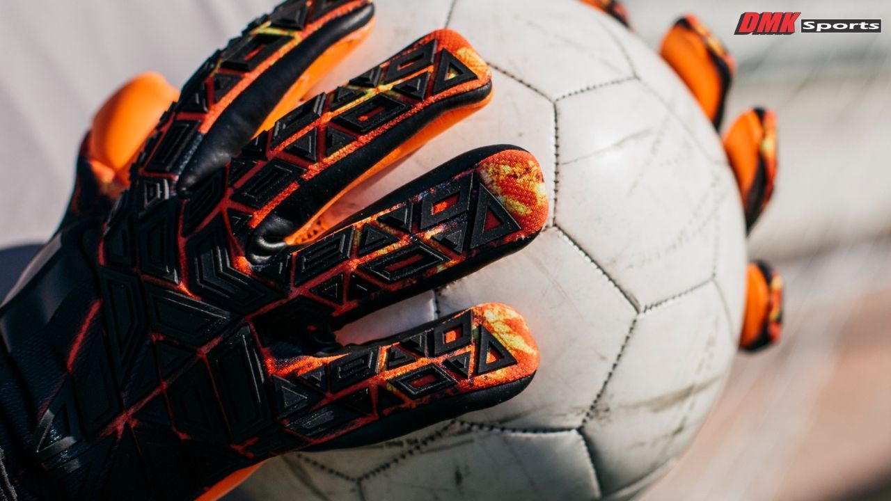 Close-up shot of soccer goalkeeper glove design and padding.
