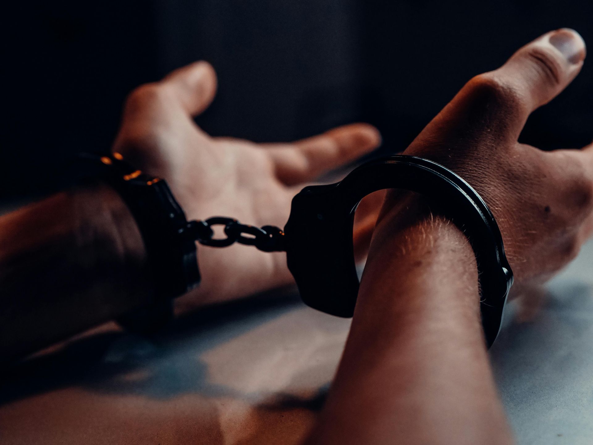 person in handcuffs