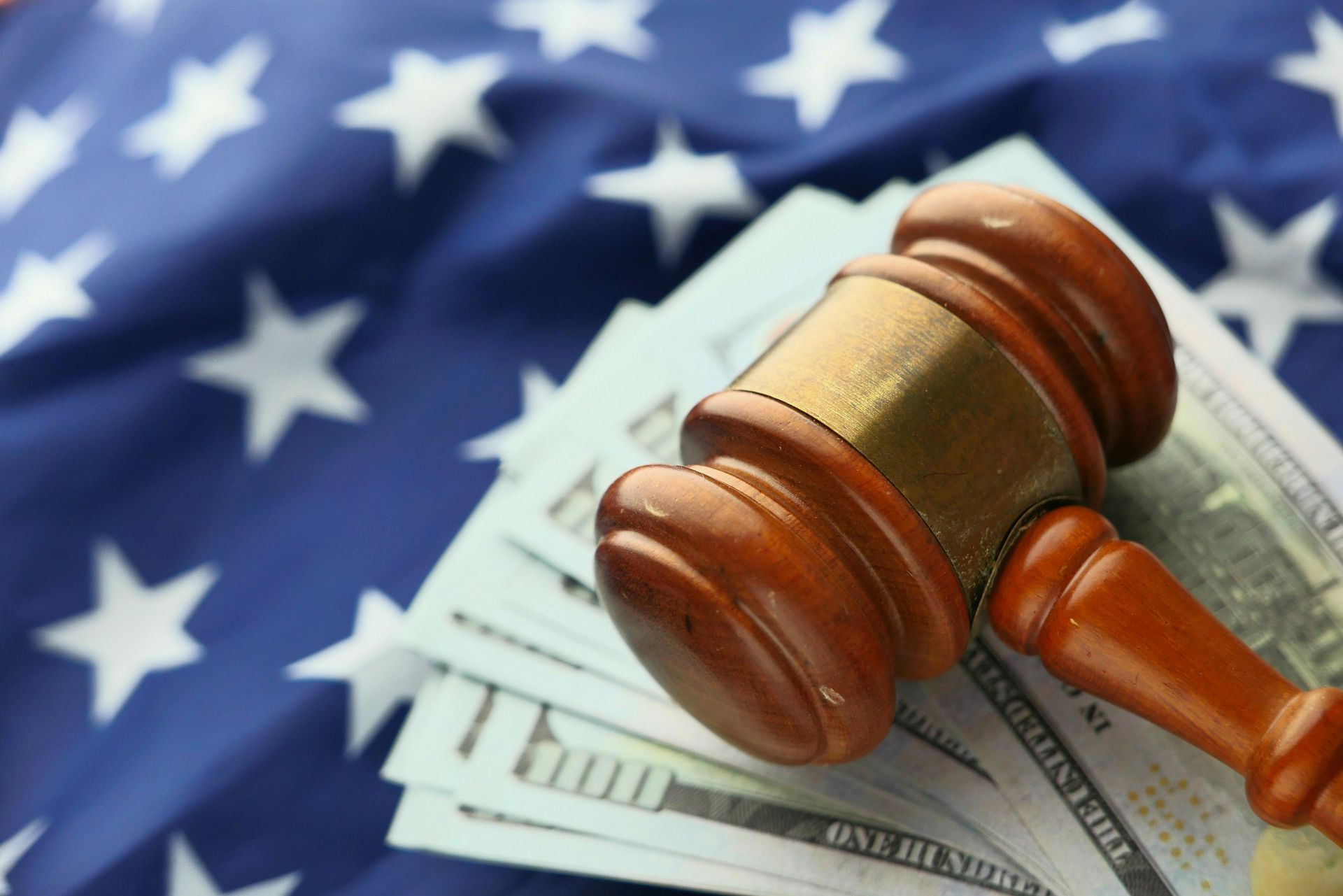 gavel and money on US flag