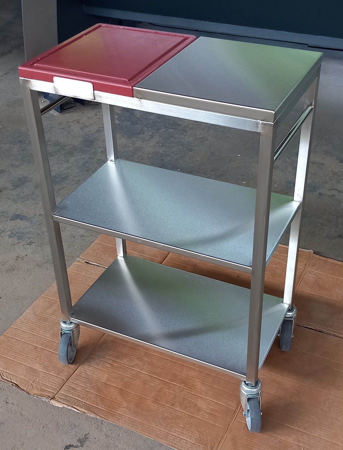 stainless steel table on castors with cutting board