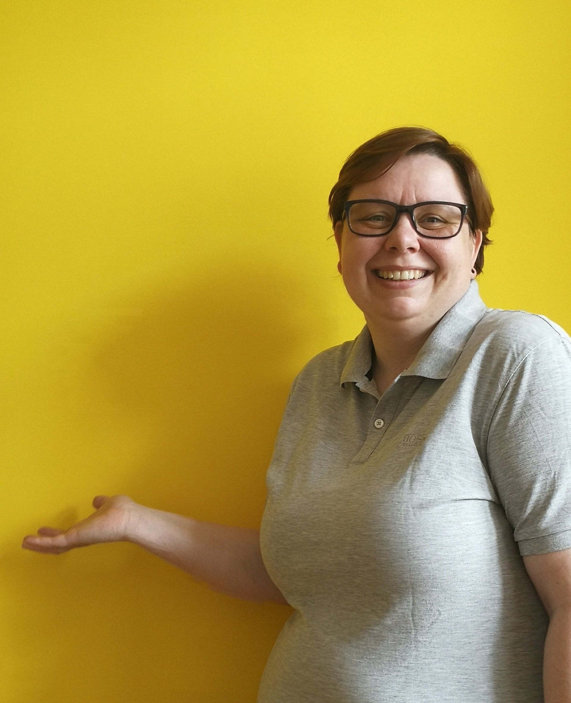 a woman named Anne Lupas on a yellow background