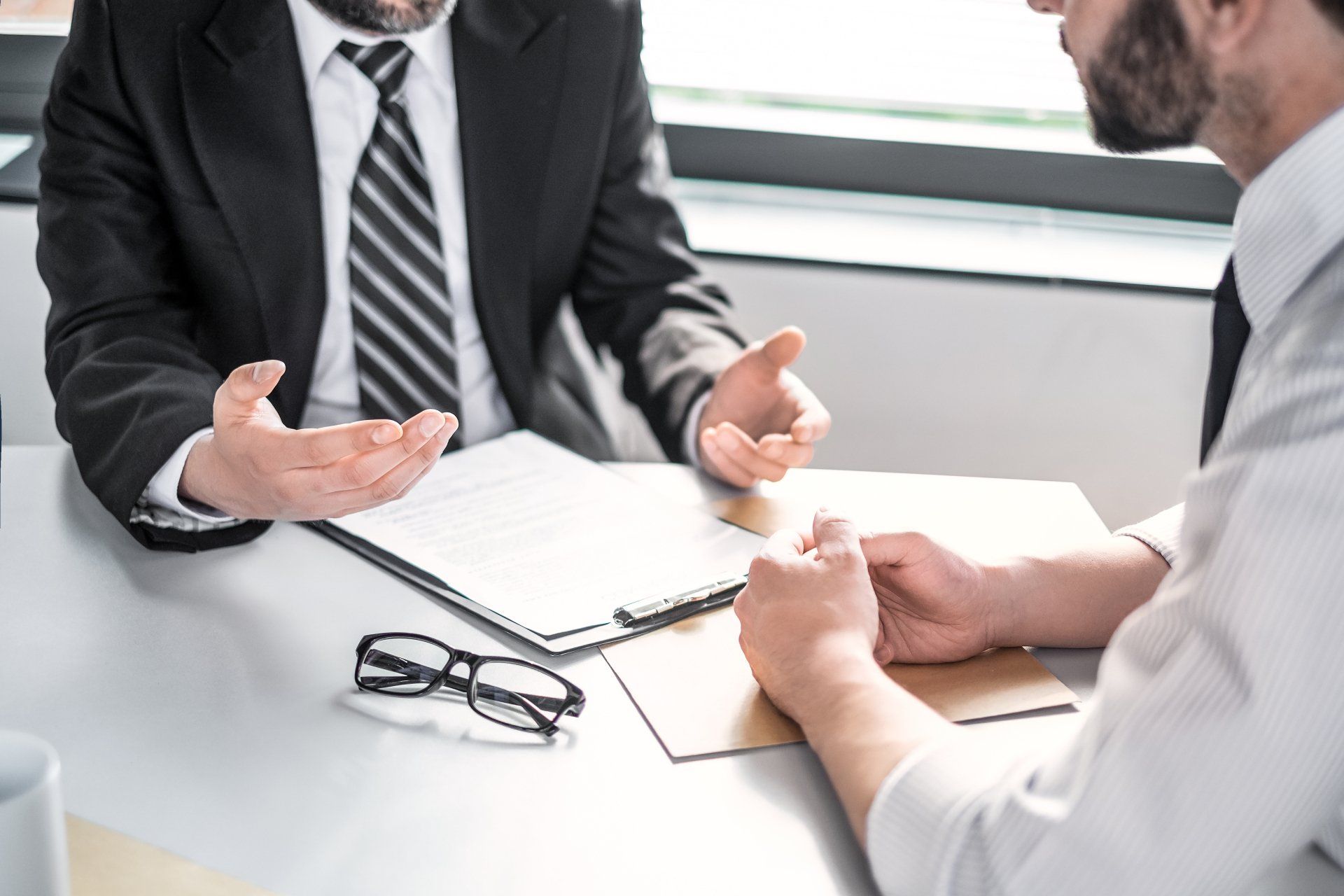Alliance & Cooper lawyer explaining something to a client