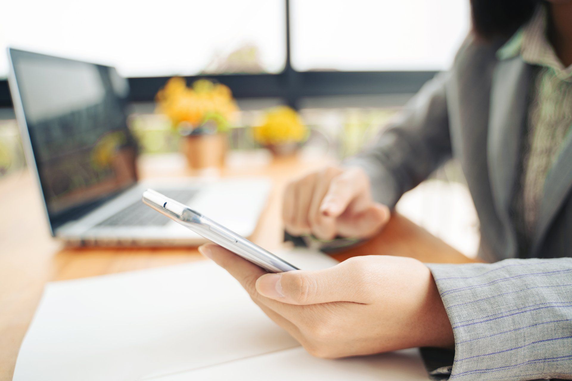 Someone dialing the number of Alliance & Cooper for legal advice