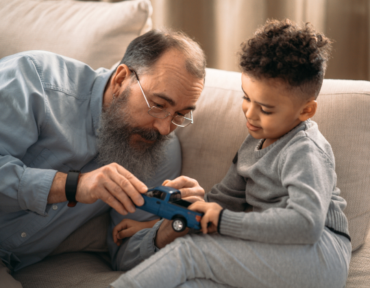 Family playing with a toy truck