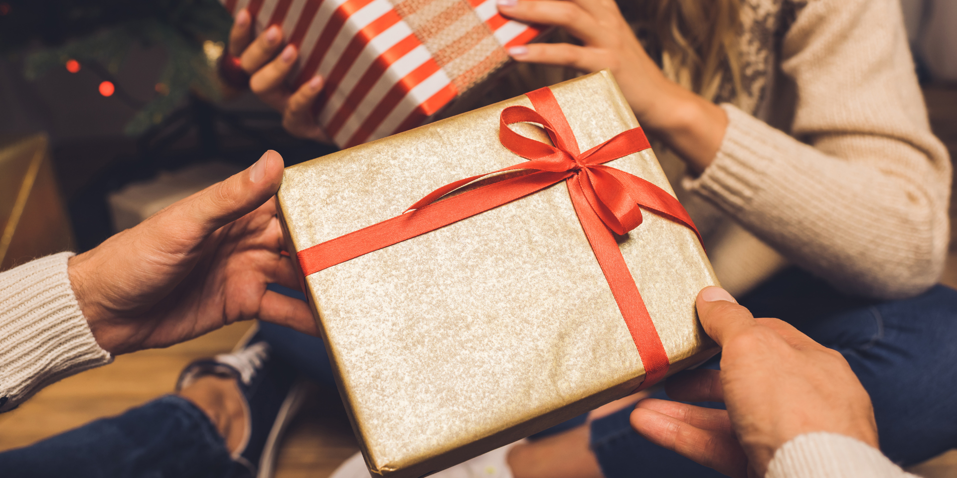 Two people exchanging gifts