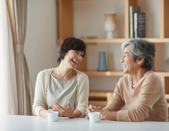 People sitting at a table and talking.