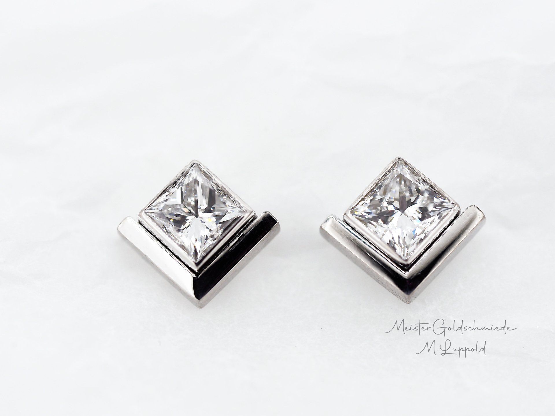 Neuanfertigung von Ohrstecker in 750/- Weißgold für Brillanterbstücke.