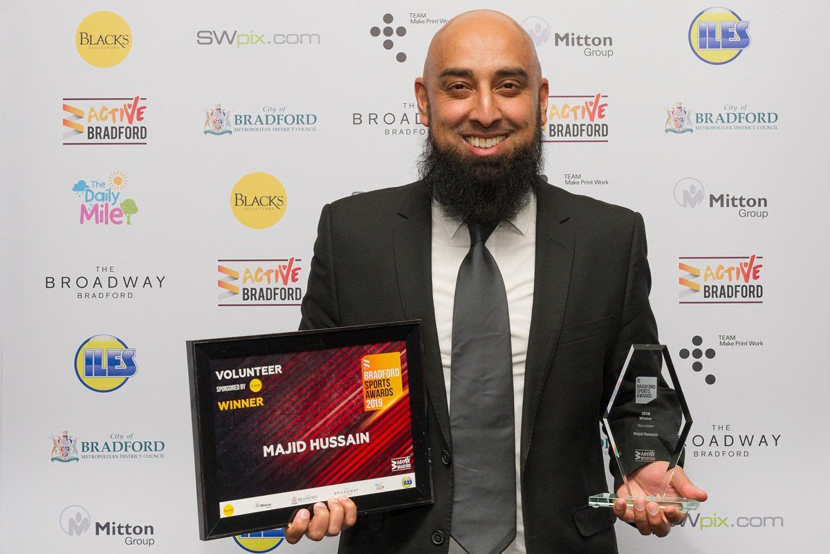 Majid Hussain poses with his award at the Bradford Sports Awards.