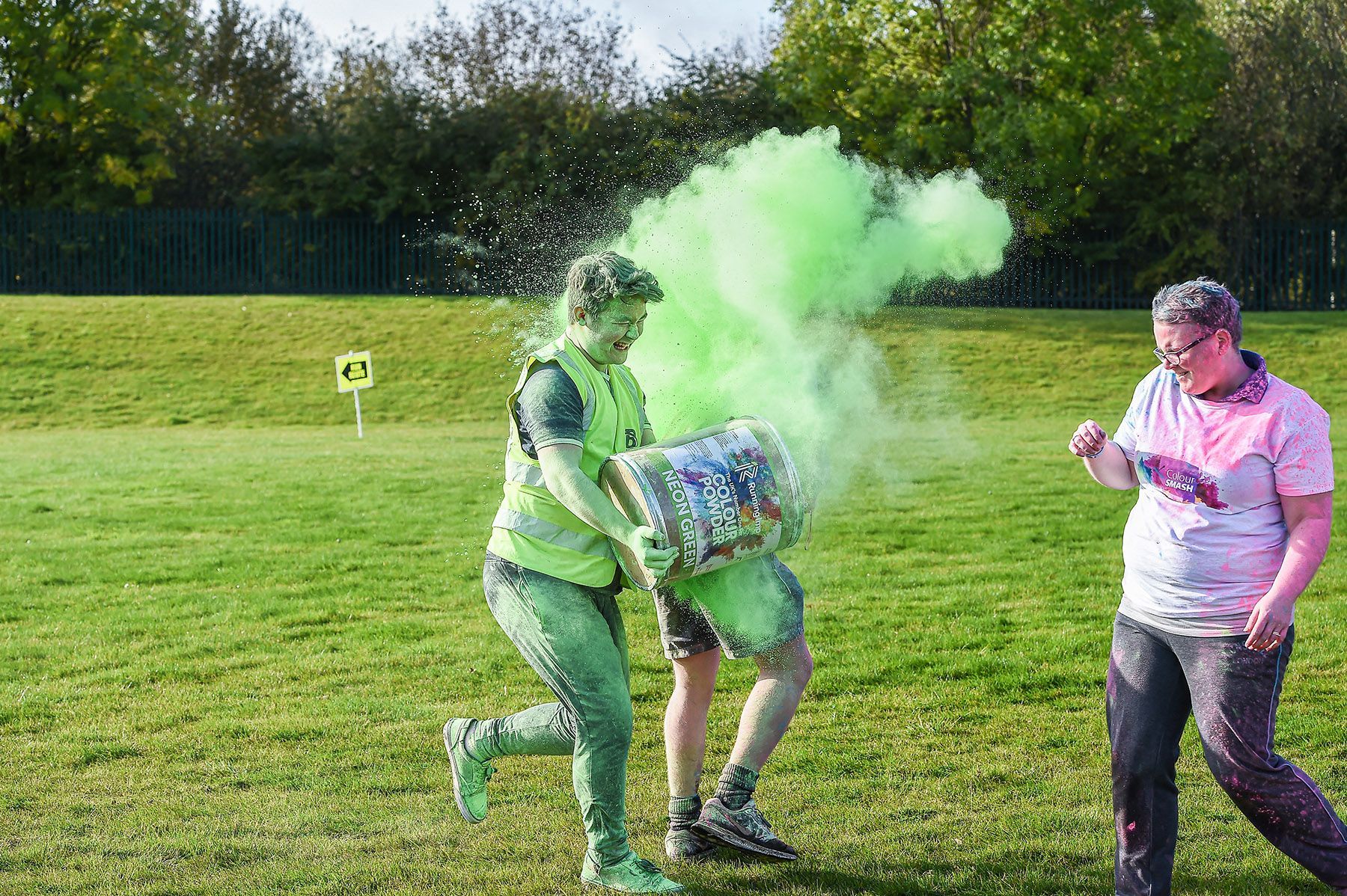 A teenager gets coloured powder thrown at him during a colour smash event.