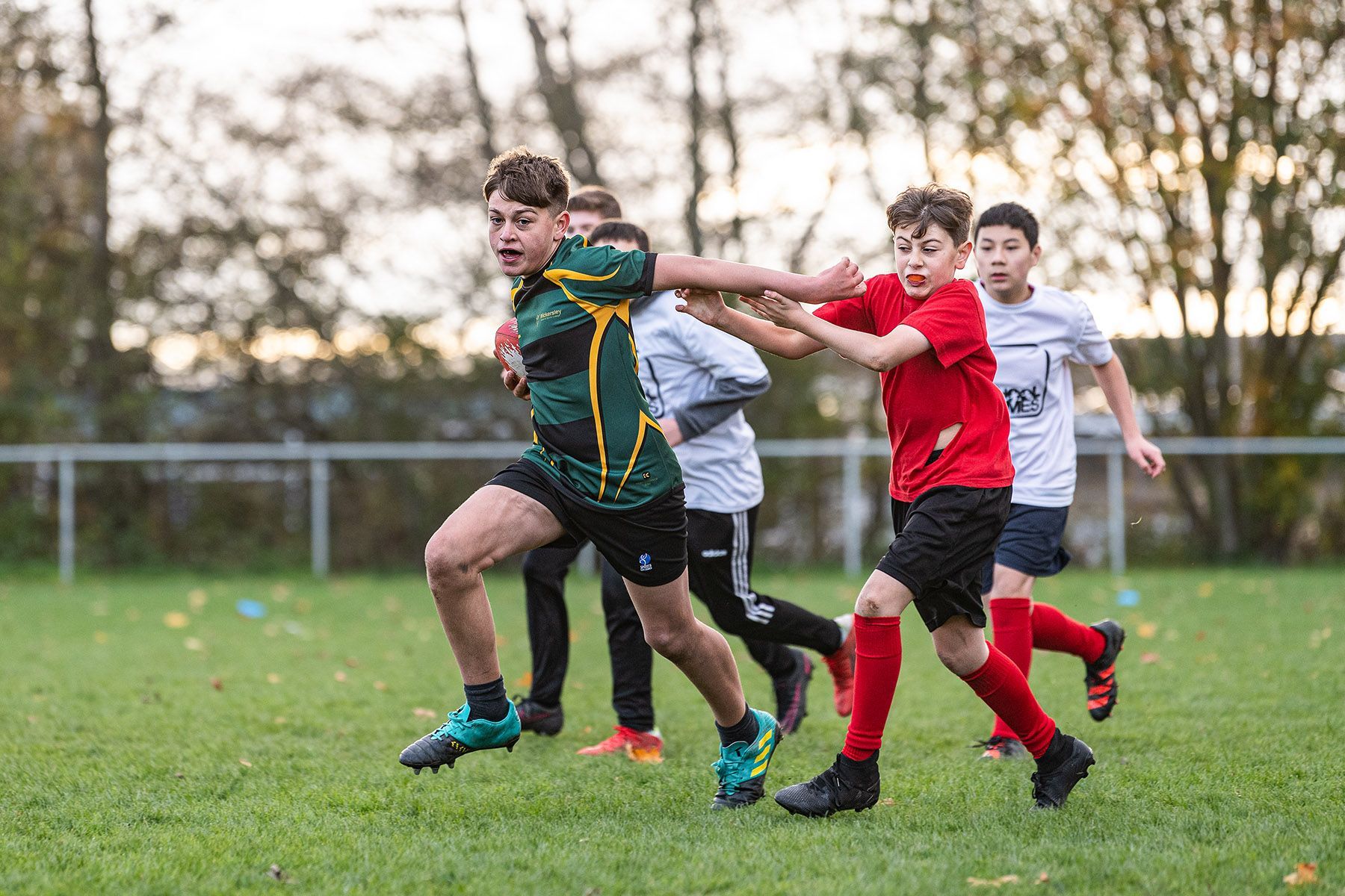 School children play a rugby game.