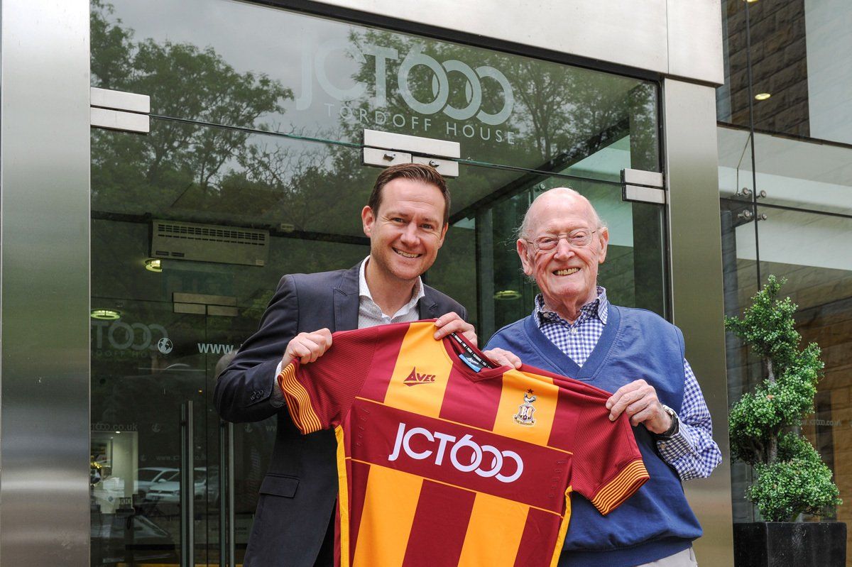 Bradford City's COO James Mason and JCT 600 founder Jack Tordoff pose with the new Bradford City Shirt.