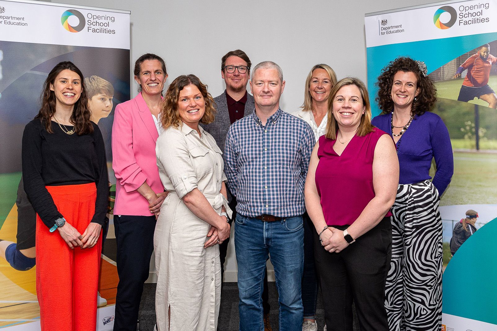 People pose at a conference