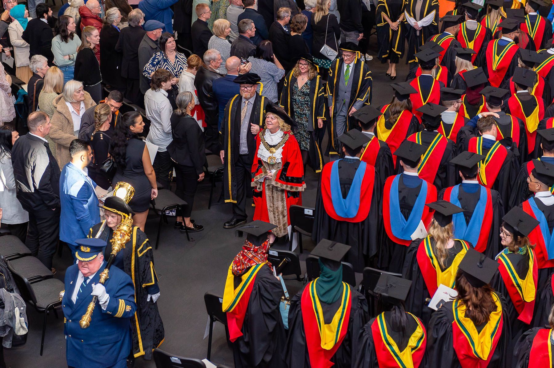 The Lord Mayor of Bradford leaves a graduation ceremony.
