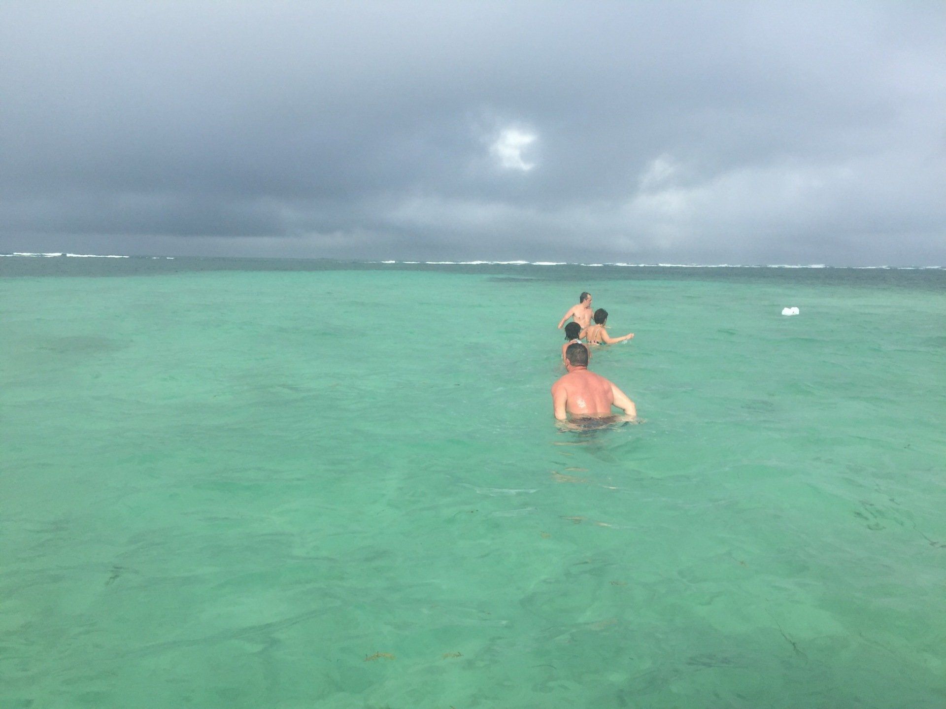 People bathing in shallow turquoise water during a half-day boat trip to Josephine’s Bath in Martinique.
