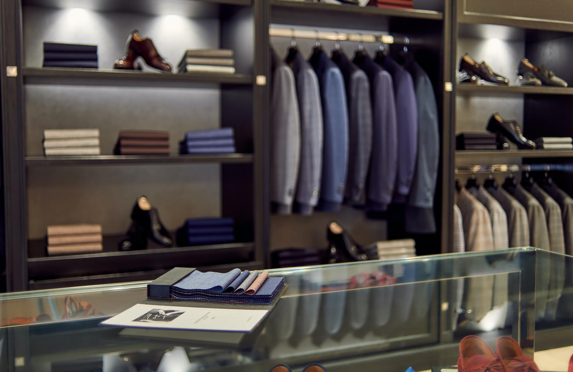 Suits hanging in a men's clothing shop