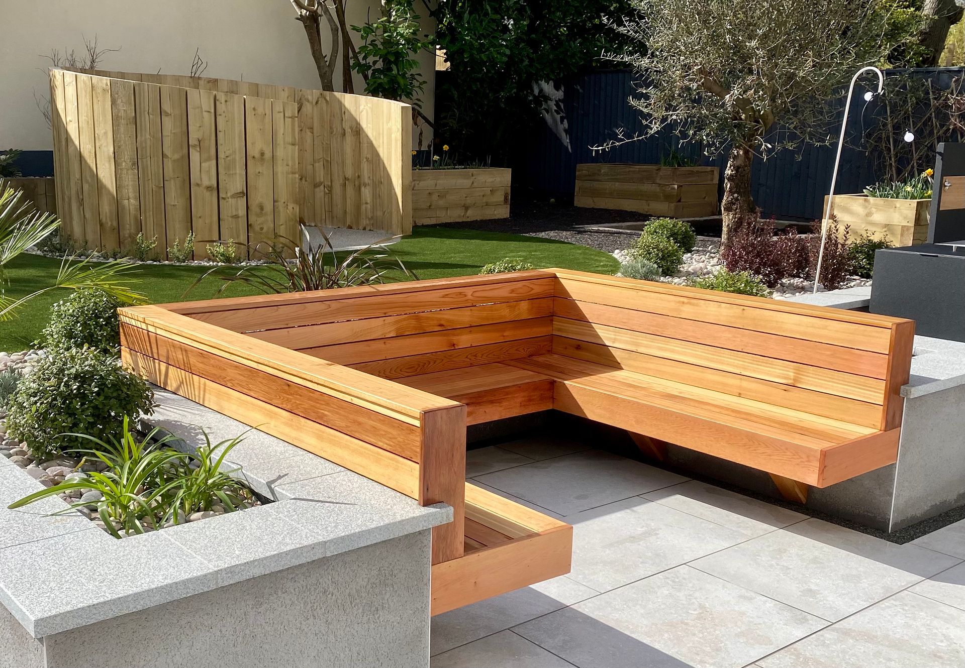 Timber built garden seating area in Kings Park Bournemouth