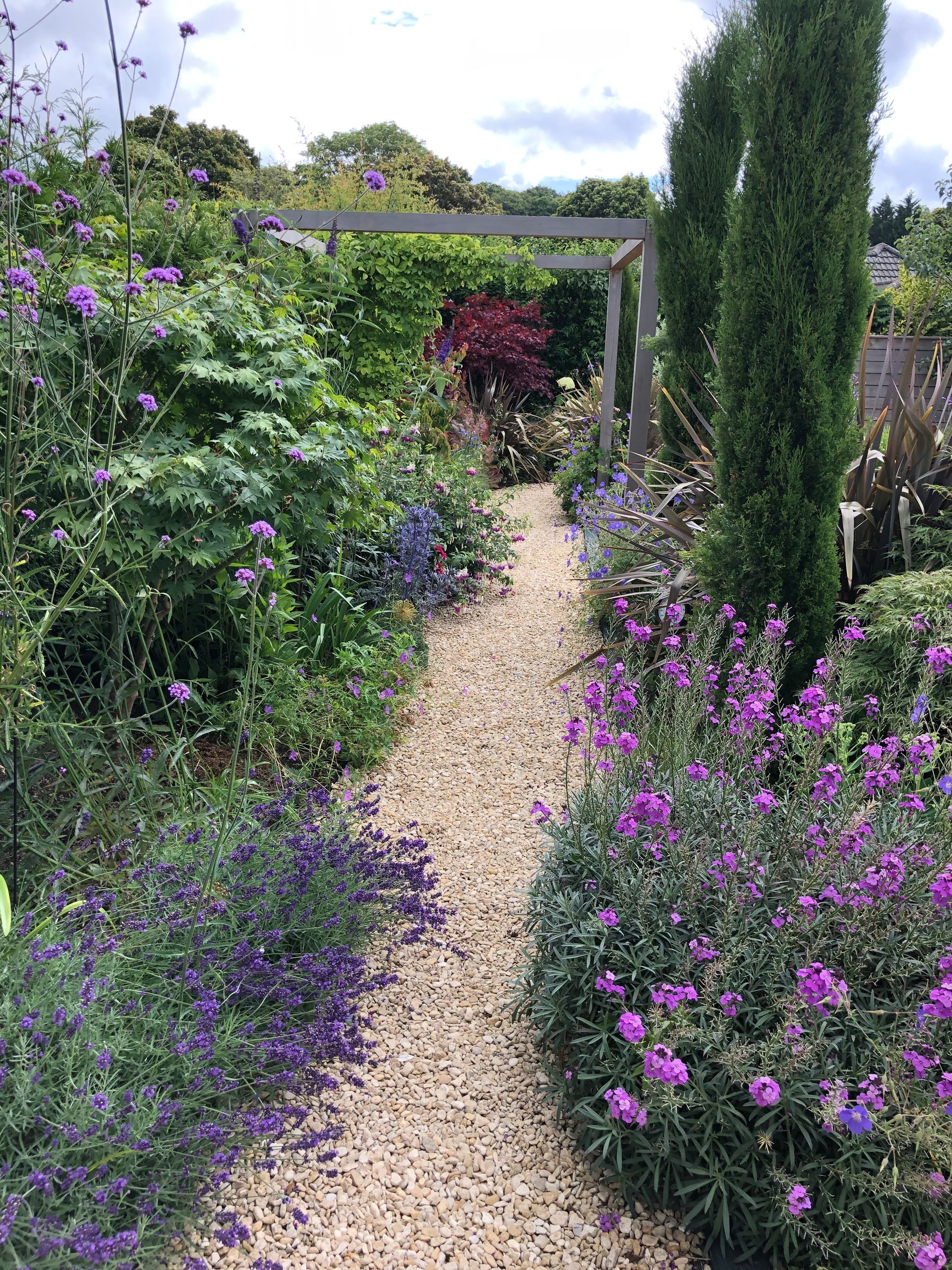 Garden pathway with flowers and bushes in Broadstone Poole