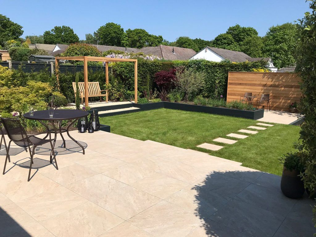 Paved patio and new lawn with stepping stones in Broadstone garden