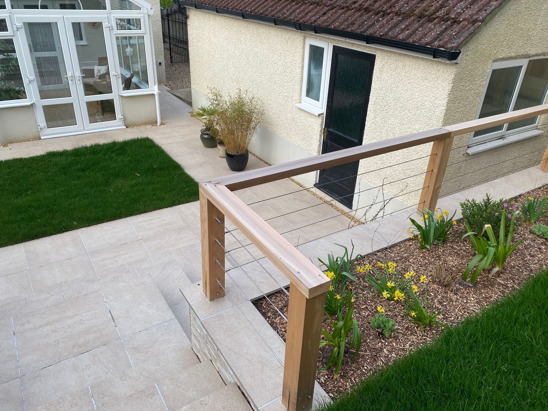 Porcelain paved steps and timber balustrade in Canford Cliffs garden