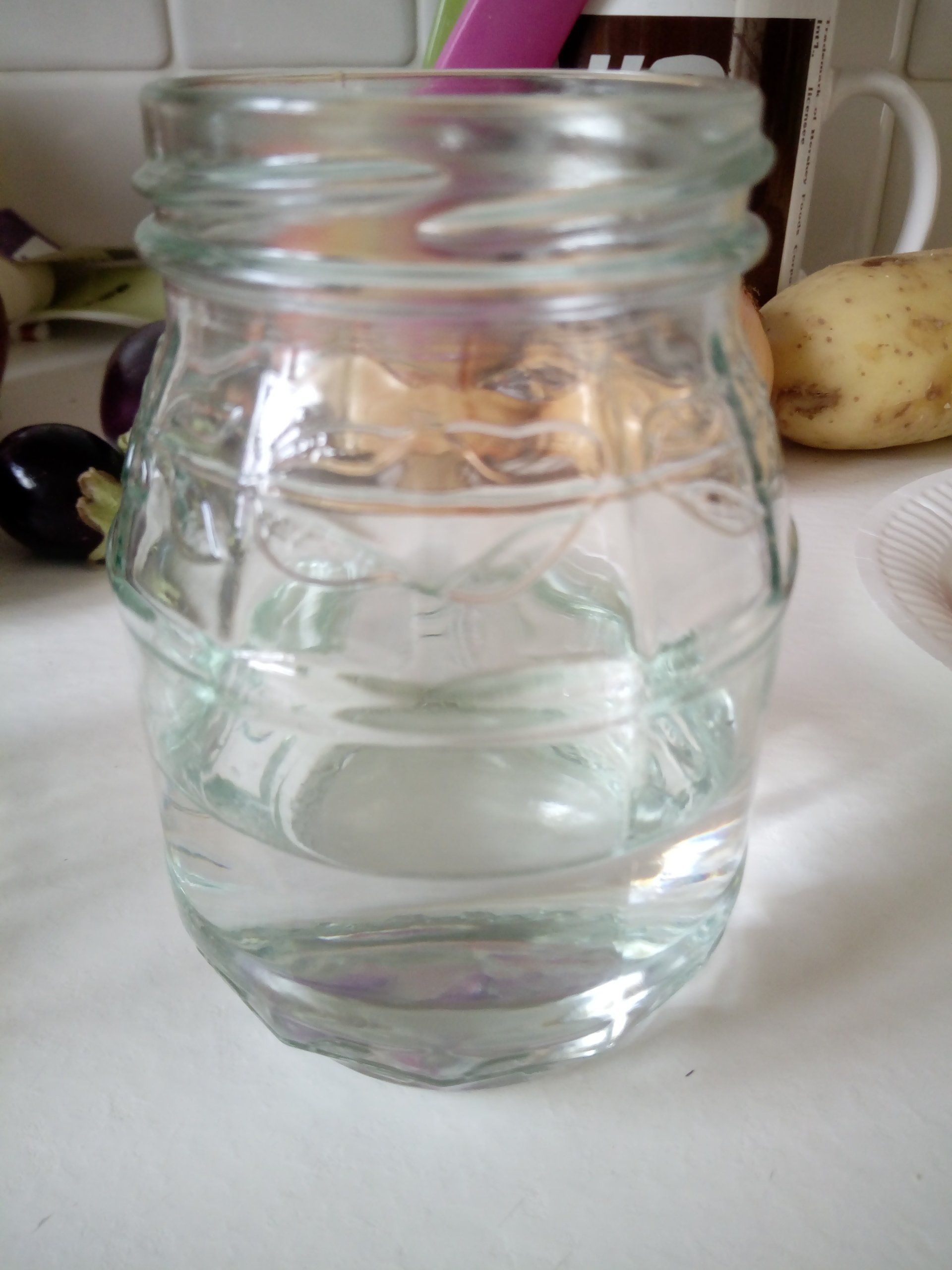 Water in the bottom of a jam jar