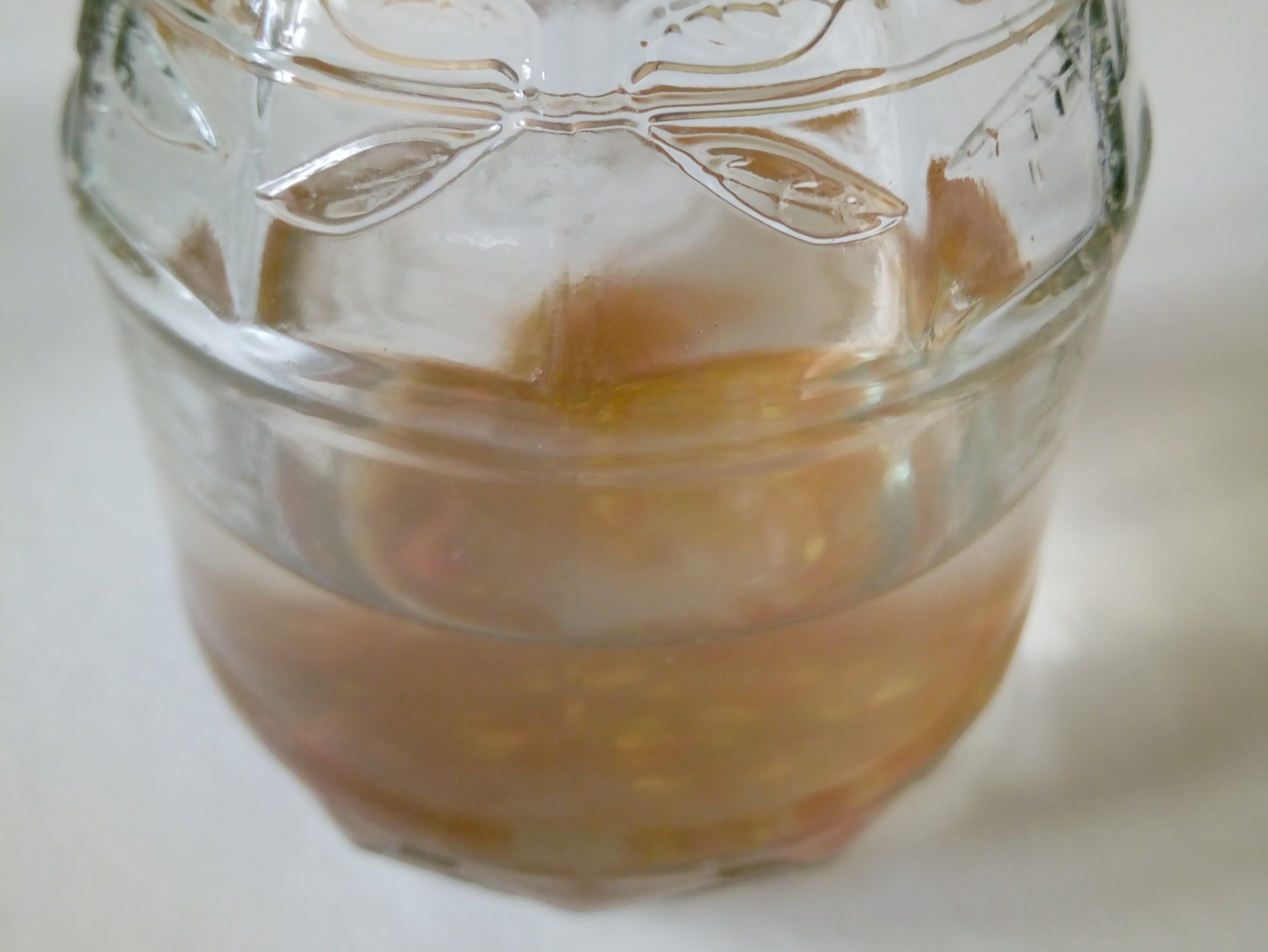 Tomato Seeds Fermenting in a Jam Jar