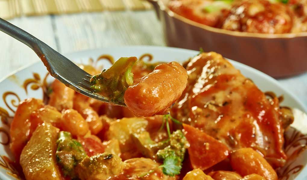 Flavourful tropical curry served with vegetables and herbs. Flavourful tropical curry served with vegetables and herbs.