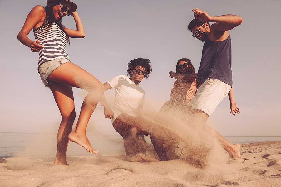 Friends enjoying a fun beach holiday together on Réunion Island. Friends enjoying a fun beach holiday together on Réunion Island.