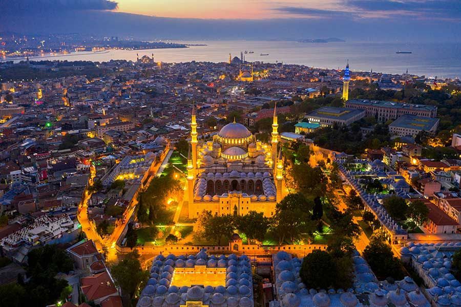 Hagia Sophia's dome and minarets at dusk, seen from the park in front