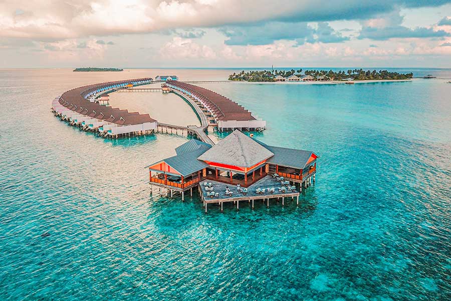 This is the ultimate screensaver dream. Hundreds of small private islands are strewn like fairy lights over 26 atolls and 871 kilometers of Tiffany-colored Indian Ocean in the Maldives. Every island resembles a rose-tinted Robinson Crusoe cliché: a lush, palm-fringed dot surrounded in ribbons of bone-white sand, lapped by tranquil waters and drenched in wall-to-wall sunlight.