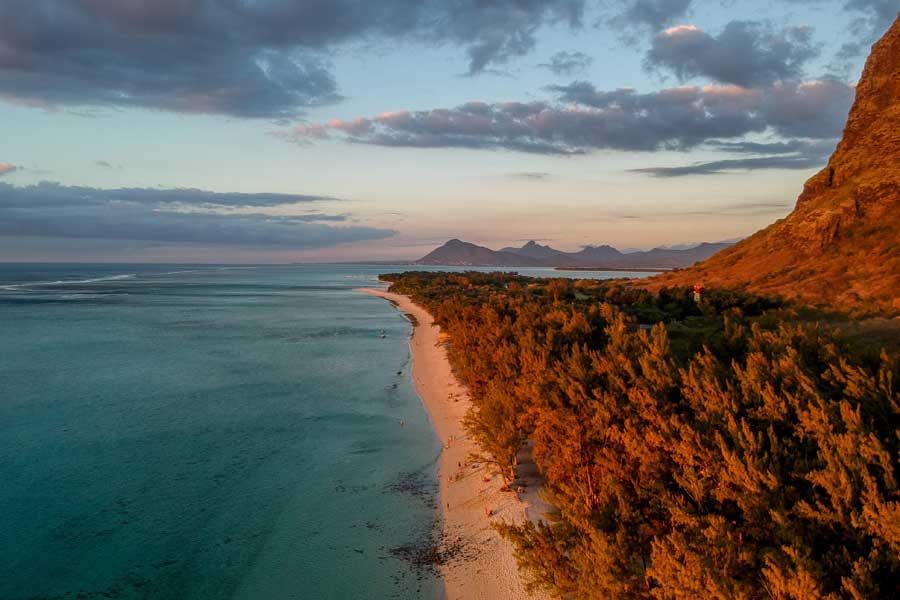 Sunset along Le Morne’s mountain-backed coastline in Mauritius. Sunset along Le Morne’s mountain-backed coastline in Mauritius.