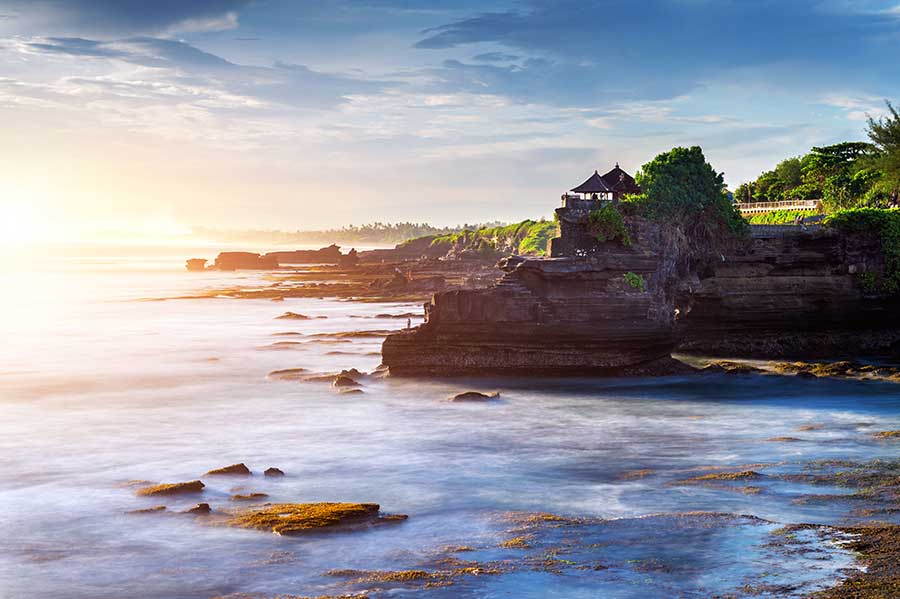 Tanah Lot Temple in Bali Rice terraces and tropical landscape in Bali