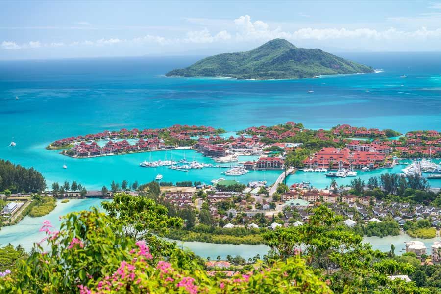 Panoramic view of Eden Island marina and turquoise waters in the Seychelles. Panoramic view of Eden Island marina and turquoise waters in the Seychelles.