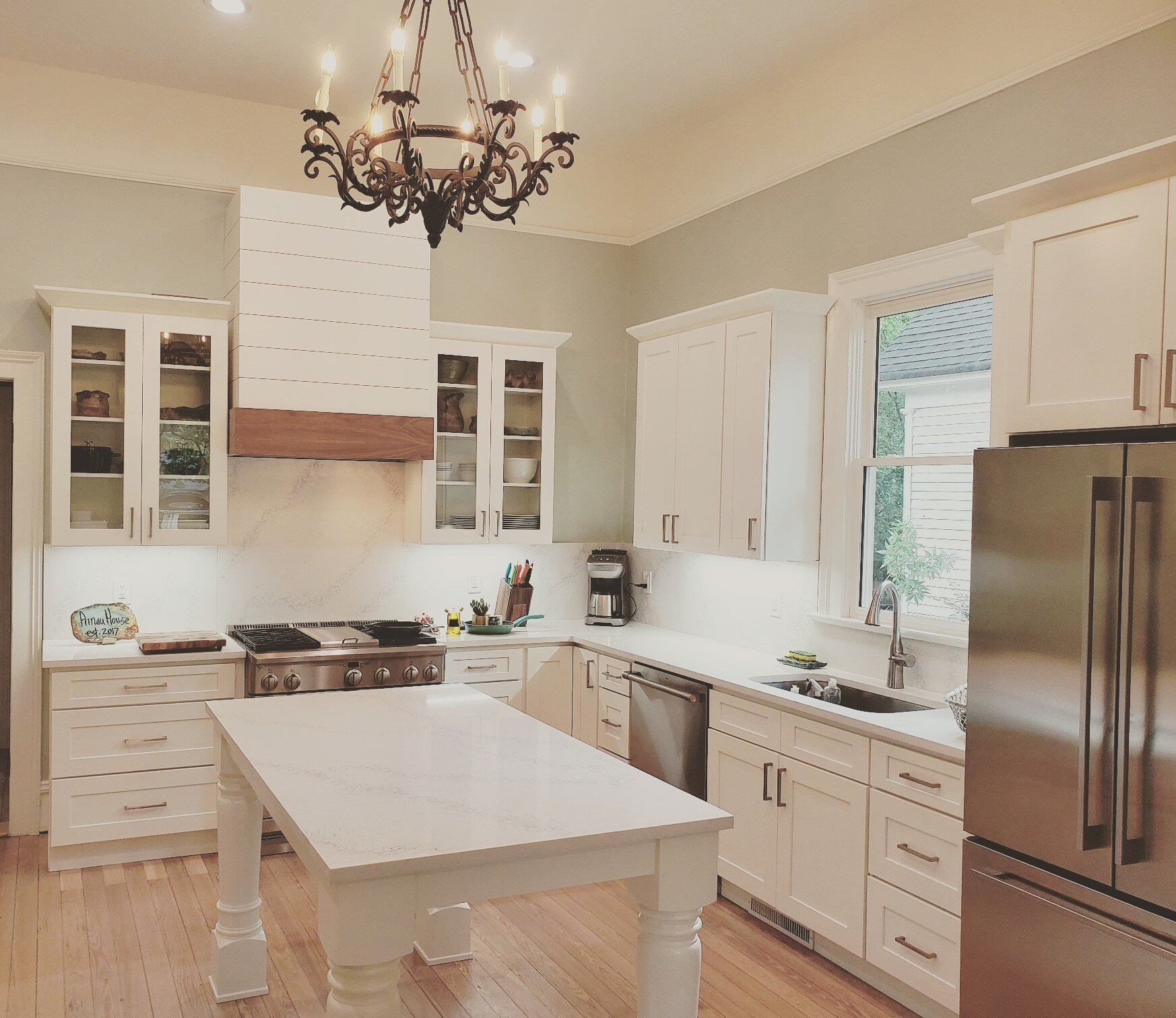 kitchen cabinets custom table like island and large wood hood