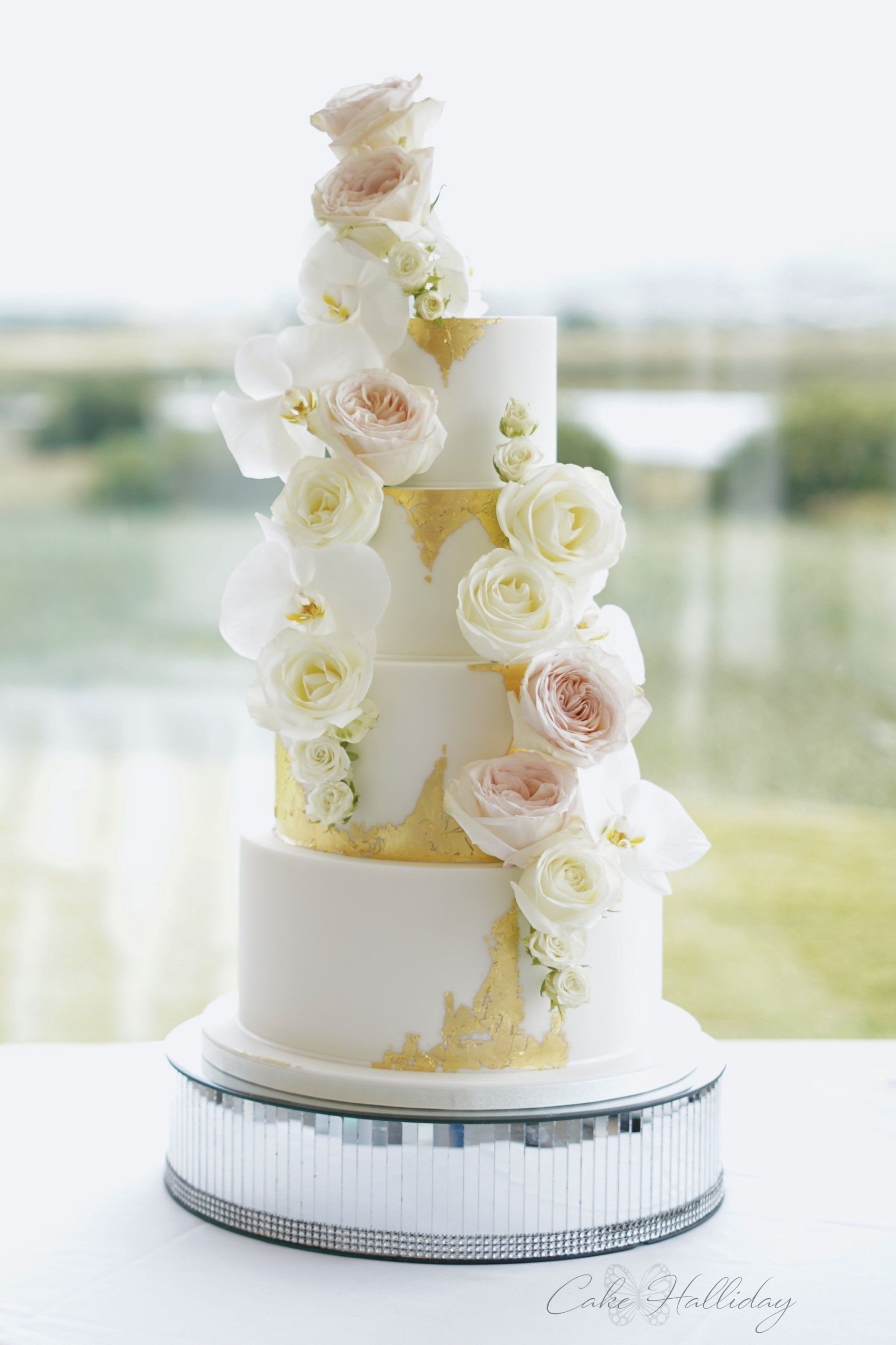 Gold leaf and roses wedding cake